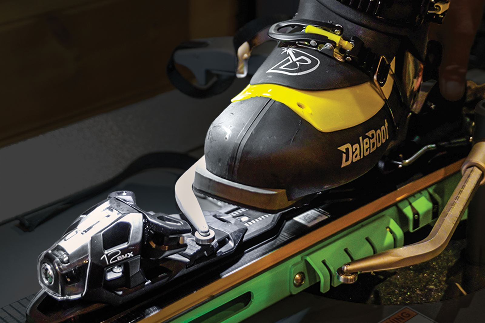 Ski boot clamped into a binding on the Wintersteiger test machine