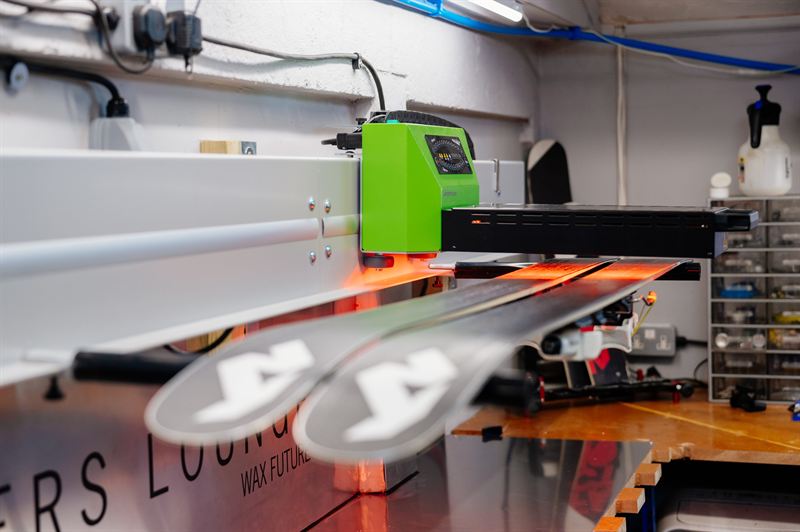 Skis on the WaxFuture infra-red waxing machine