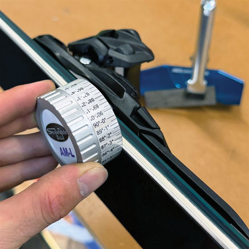 Checking a ski edge angle with a bevel gauge